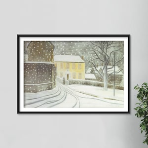 May include: A framed watercolor painting depicts a snowy winter scene. A yellow building with multiple windows is the focal point, with a snow-covered road leading towards it. Snowflakes fall, and bare trees are visible.