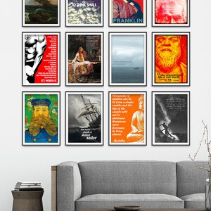May include: A living room interior with a gray sofa and a wooden coffee table. The wall is decorated with nine framed prints featuring inspirational quotes and images. The prints include quotes from Franklin, Buddha, Socrates, and others. The prints are in various colors, including red, blue, yellow, and black.