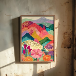 May include: A framed wall art print featuring a vibrant landscape with rolling hills in shades of pink, orange, yellow, and blue, decorated with various patterns. The foreground displays colourful flowers including pink tulips and daisies.