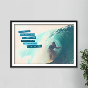 May include: A motivational quote about making waves, set against a blue and white watercolor background with a surfer riding a wave.