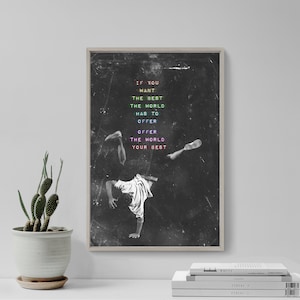 May include: Black and white image of a person doing a handstand with the text "If you want the best the world has to offer offer the world your best" in rainbow colors.