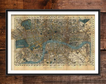 May include: Framed vintage map of London, featuring the Thames River and surrounding areas. The map has a cream-colored background with blue and brown details, and the title "Smiths New Map of London" is visible at the top.