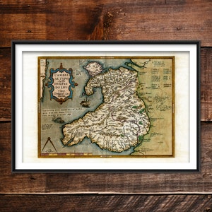 May include: An antique map of Wales, titled "Cambrae Ae Typvs Avthore Hvmfre Do Liv Ydo", with a compass and a ship in the bottom left corner.