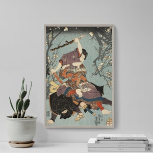 May include: A vintage Japanese woodblock print depicting two samurai warriors in a dramatic fight scene. The print features a blue and white background with a blossoming cherry tree in the background. The samurai are wearing traditional armor and wielding swords.
