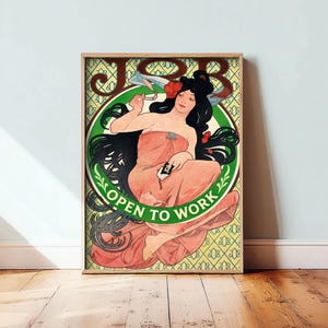 May include: A framed art print featuring a woman with long dark hair wearing a peach-colored garment. She holds a cigarette and a small pack labeled JOB. The background has a yellow geometric pattern, a green circular border, and the text JOB OPEN TO WORK.