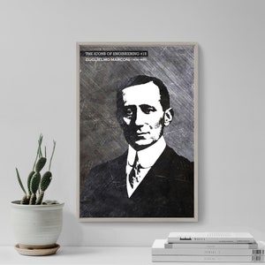 May include: A framed black and white portrait of Guglielmo Marconi, part of "The Icons of Engineering" series. The image features a grayscale portrait against a textured background, with text at the top. A cactus in a white pot is on the left.