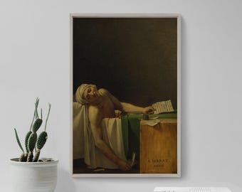 May include: Framed print of a neoclassical painting depicting a man lying in a bathtub, with a white cloth and green fabric. The painting has a dark background and a wooden box with text. A cactus in a white pot is in the foreground.