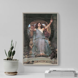 May include: A painting of a woman in a flowing blue gown, holding a goblet and a sword, sitting on a throne with a lion head on each side. The woman is surrounded by a circular frame with a mirror inside. The background is dark and the painting has a vintage feel.