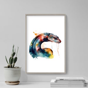 May include: A watercolour painting of a colourful snake with a blue, green, orange, and red colour scheme. The snake is curled up in a coil with its head raised and its tongue sticking out. The background is a white watercolour wash with splashes of colour.