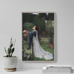 May include: A framed print of a classical painting. The artwork depicts a woman in a white gown and blue shawl, leaning against a stone structure in a garden. The scene includes greenery, a staircase, and a large urn.