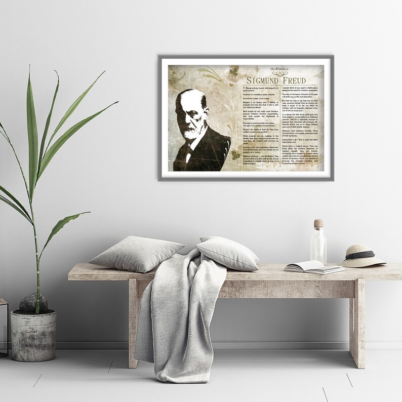 May include: A framed print of Sigmund Freud, a famous psychologist, with a quote about life and death. The print is in a vintage style with a brown and white color scheme.