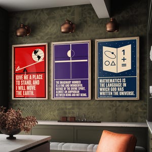 May include: Three framed rectangular wall art prints featuring scientific quotes. The red print shows a globe on a lever with the text Give me a place to stand, and I will move the earth. The purple print features geometric lines and text. The blue print displays math symbols and the text Mathematics is the language in which God has written the universe.
