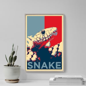 May include: A vintage-style poster featuring a snake with a red, white and blue colour scheme. The snake is depicted in a bold, graphic style, with the word "SNAKE" printed in large, blue letters at the bottom.