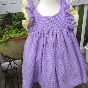 Girls purple seersucker dress with yellow ruffles