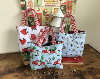 Bolsa de regalo reutilizable para las fiestas, regalo sostenible de Peanuts, decoración navideña de Snoopy, bolsa de regalo de tela, hecha con tela con licencia de Peanuts.