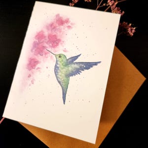 Cartão de beija-flor com flor de cerejeira