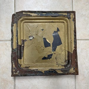 May include: A white ceramic mug with a black handle and the text "But First, Coffee" in a black, bold font. The mug is on a white surface.