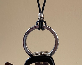 Eyeglass necklace. Hematite circle pendant glasses holder.  Black leather cord unisex metallic ring glasses lanyard.