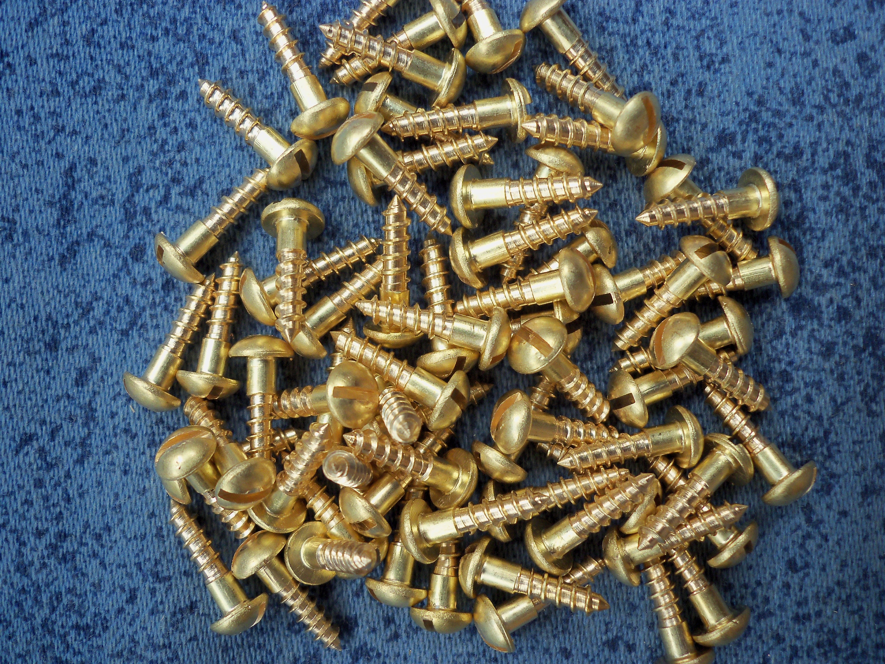 3 x 12 mm solid brass wood screws with slotted round head.