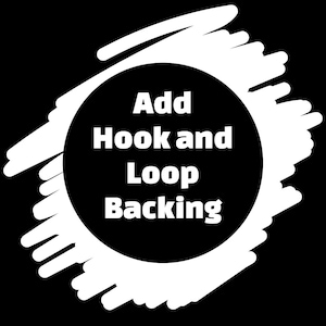 May include: A black and white graphic with the text "Add Hook and Loop Backing" in a white, bold font, centered within a black circle. The circle is surrounded by white brushstrokes against a black background.