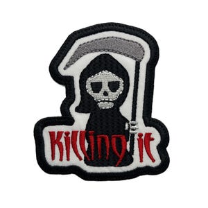 May include: Embroidered iron-on patch featuring a cartoon Grim Reaper holding a scythe with the text "Killing it" in red.