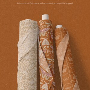 May include: Three fabric rolls with different patterns. The first roll has a beige background with a light brown leaf pattern. The second roll has a beige background with a brown, red, and white floral pattern. The third roll has a brown background with a white butterfly pattern.