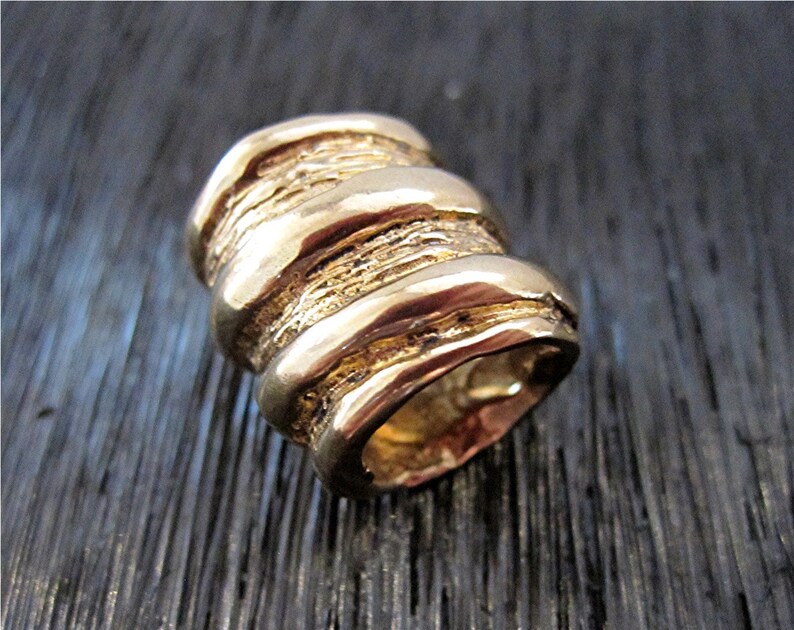 A Large Gold Bronze Artisan Coil Bead and Slider one
