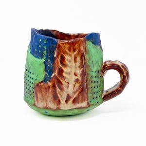 Handmade Stoneware Coffee Mug: Multi-Colored Leaf Design