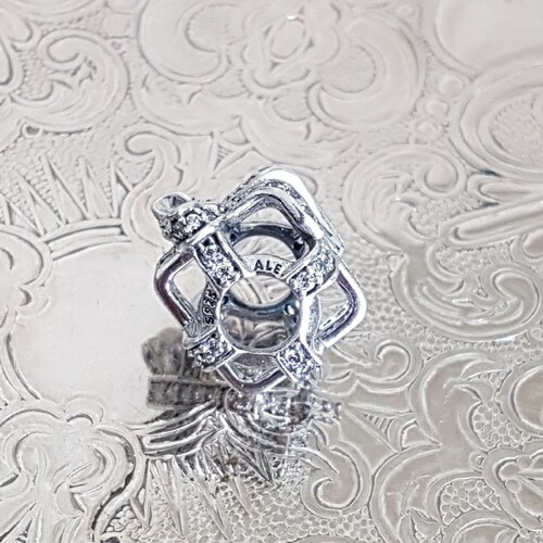 Authentic Pandora All Wrapped Up Open Work Charm Exquisite Sterling Silver shops Clear CZ Hallmarked S925 ALE RETIRED Nwot Item#791766CZ