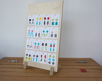 Personalised hooked jewellery card display with engraved logo. Quality Birch ply wood earring stand with 16 hooks for market and shop.