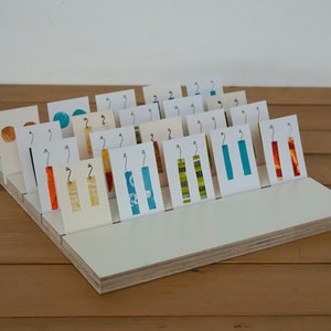 White rectangular or square high-quality wooden slotted earring card display board. Premium Birch ply. Jewellery product card display.