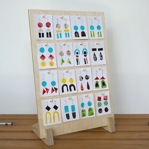 Hooked jewellery card display. Quality Birch ply wood earring stand with 16 hooks for market and shop. Folds Flat. Easy assemble