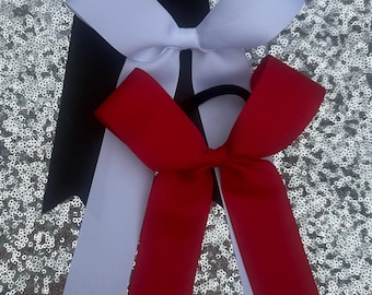 Solid 1.5 inch wide College style cheer bows.  Dance Teams long tails