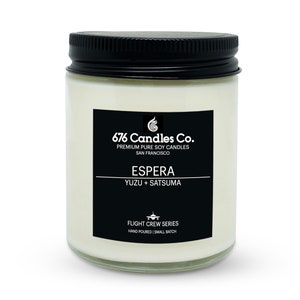 May include: A white soy candle in a clear glass jar with a black lid. The label is black with white text that reads "676 Candles Co. Premium Pure Soy Candles San Francisco", "ESPERA", "YUZU + SATSUMA", "FLIGHT CREW SERIES", and "HAND POURED | SMALL BATCH".