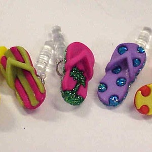 May include: Six colorful flip-flop charms with different patterns, including stripes, polka dots, and a palm tree design. These charms are perfect for adding a touch of summer fun to your phone case, bag, or keychain.