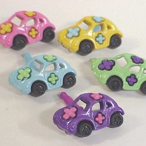 May include: Five colorful plastic toy cars with flower designs. The cars are pink, yellow, light blue, green, and purple.