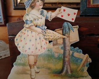 Vintage moveable Valentine card with girl in bonnet, umbrella, placing card in mailbox