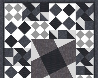 May include: A geometric quilt in shades of gray, black, and white. The quilt features a repeating pattern of diamonds, squares, and triangles. The border is a solid dark gray. The quilt is a patchwork design.