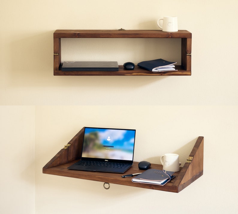 May include: A wooden wall-mounted shelf with a laptop, a notebook, a mouse, and two mugs. The shelf folds down to create a desk.