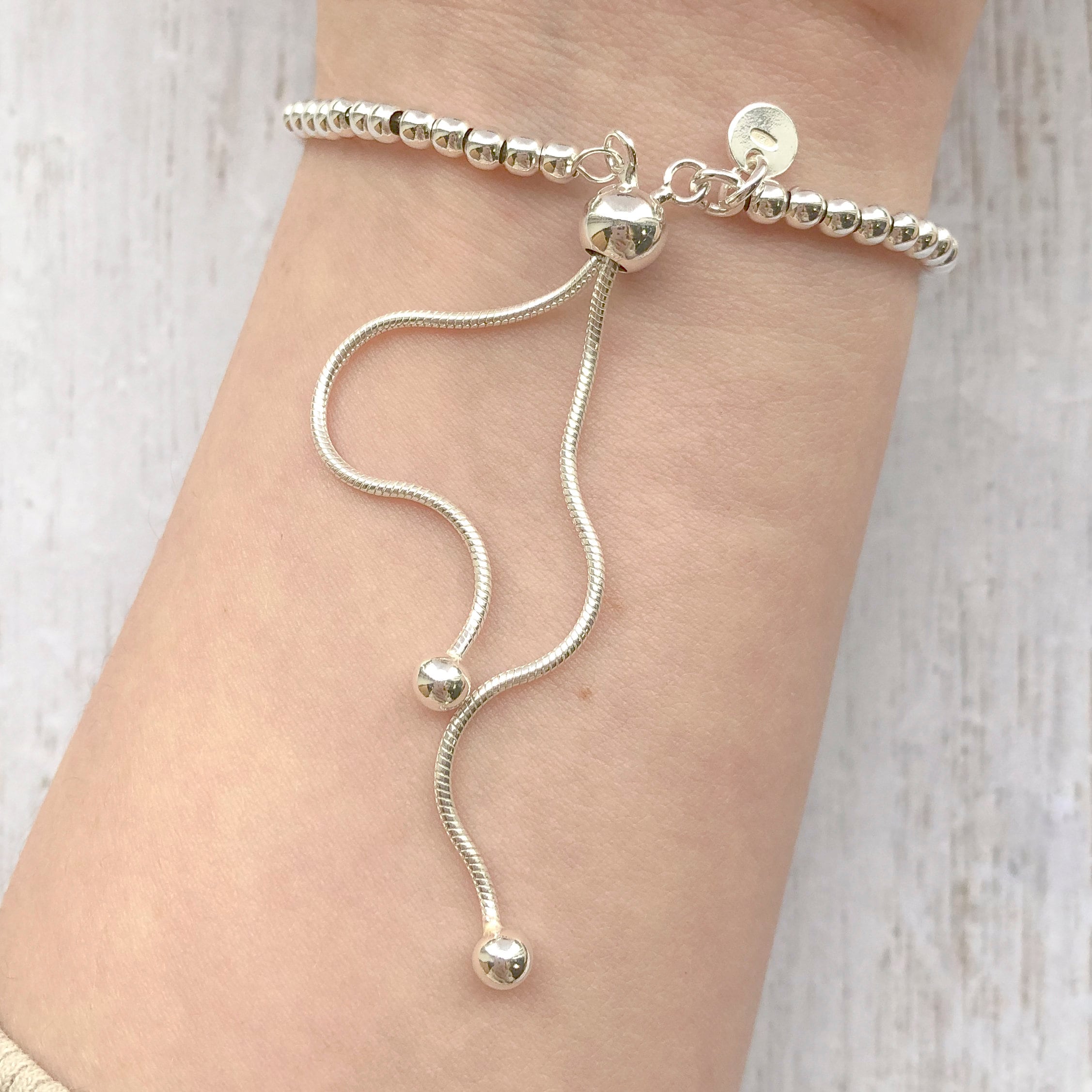 Amazon.com: Jewels By Lux Leslie's Sterling Silver Diamond-cut Bracelet  Adjustable Bracelet: Clothing, Shoes & Jewelry