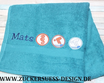 Towel with embroidery and swimming badge