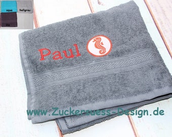 Towel with embroidery and swimming badge