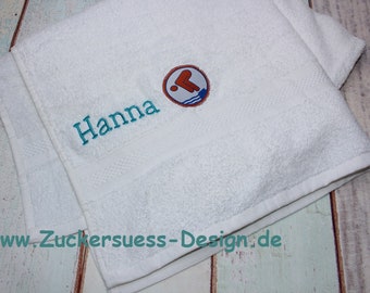 Towel with embroidery and swimming badge