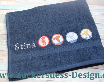 Bath towel with embroidery and swimming badges