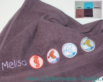 Towel with embroidery and swimming badge