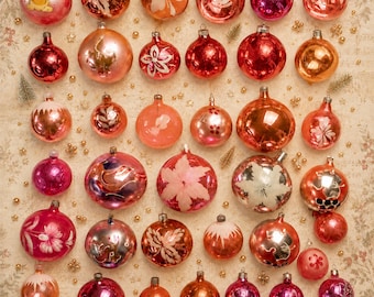 May include: A collection of various spherical glass Christmas ornaments in shades of pink, red, and copper. The ornaments feature diverse finishes including metallic, glossy, and matte, with some decorated with painted floral and star patterns.
