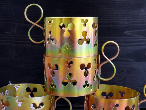 glass and metal tea cups