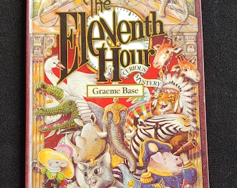 The ELEVENTH HOUR Curious Mystery (1989) by Graeme Base - Vintage Glossy Hard Covert - Classic Children's Book Like New Condition!