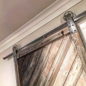 Sliding barn door hardware