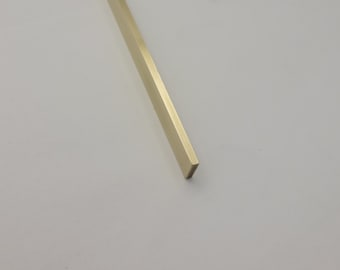 Brass for inlays 1/8" x 1/8" or 1/8" x 1/4" polished brass rod.  These are 6" long-ask for other lengths